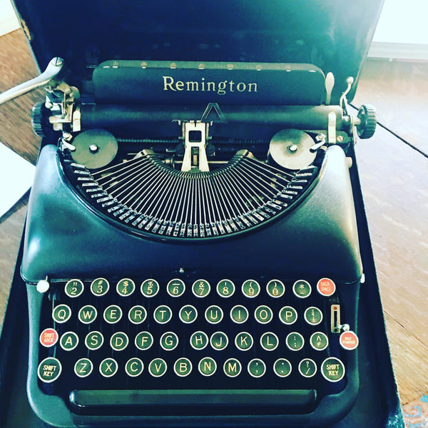 An old Remington typewriter in its box.