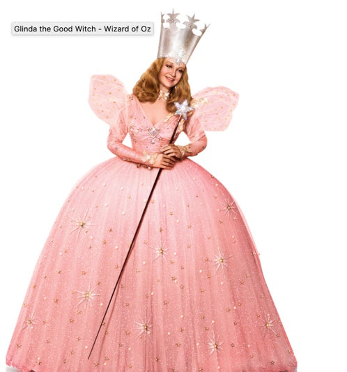 Glinda the Good Witch from The Wizard of Oz, wearing a full fluffy dress, a crown and holding a star wand.