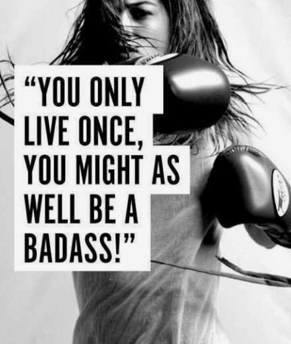 An action shot of a woman with boxing gloves on, mid strike, with the text over her, "You only live once, you might as well be a badass!"