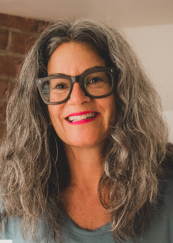 smiling woman with glasses