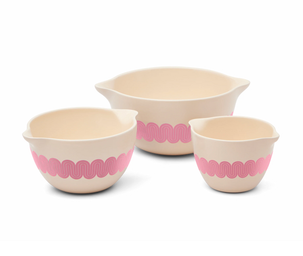 3 mixing bowls with pink swirly design on the outside